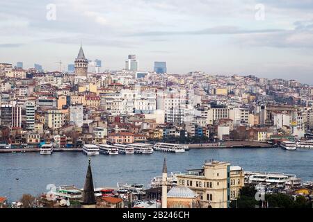 Istanbul / Turkey - 01/20/2019: View of Cityscape with Galata Tower and Golden Horn from garden of the Suleymaniye Mosque. Stock Photo