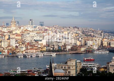 Istanbul / Turkey - 01/20/2019: View of Cityscape with Galata Tower and Golden Horn. Stock Photo