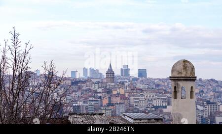 Istanbul / Turkey - 01/20/2019: View of Cityscape with Galata Tower and Golden Horn from garden of the Suleymaniye Mosque. Stock Photo