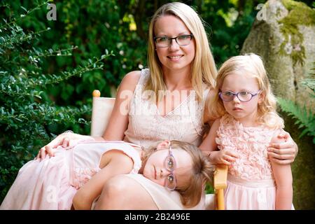 Mother with daughters, 6 years old, 3 years old, two girls, siblings, portrait, Czech Republic Stock Photo