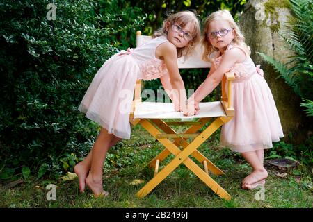 6 years old, 3 years old, two girls, siblings, portrait, Czech Republic Stock Photo
