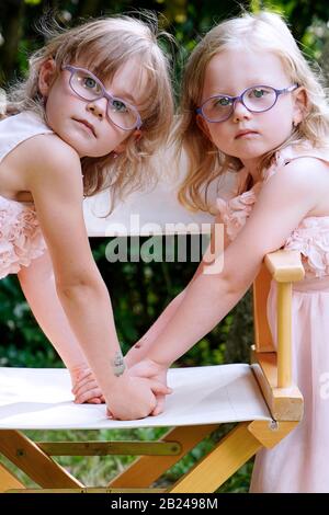 6 years old, 3 years old, two girls, siblings, portrait, Czech Republic Stock Photo