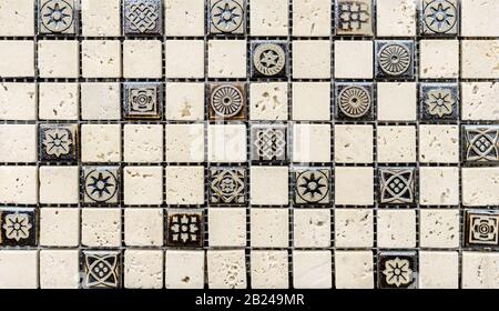 Beige quartz mosaic tiles with embossed patterns to decorate the kitchen, bathroom or pool. Stock Photo