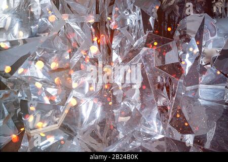 Abstract winter background with ice texture and silver,gold bokeh lights.Abstract glitter background. Shiny glittering bokeh christmas.Defocused Light Stock Photo
