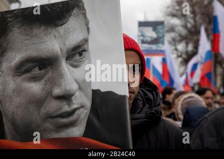 A man holds a placard with a portrait of Russian president Vladiir ...