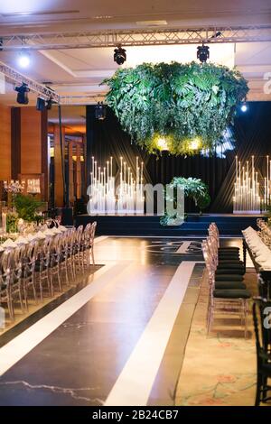 Wedding ceremony area and monstera aquarelle. Stock Photo