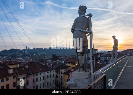 Vicenza, Italy. December 26, 2016:  Statues on the roof of the Palladian Basilica at sunset Stock Photo
