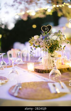 Wedding dining table. Table number nine. Rustic wedding. Stock Photo