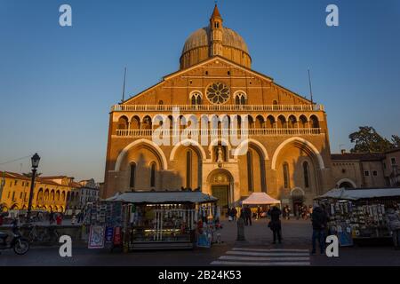 PADUA, ITALY - December 28, 2016 - Souvenir sellers and tourists in front of the Basilica of Sant'Antonio da Padova at sunset Stock Photo