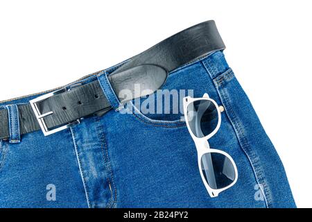 Trousers with sun-covered glasses lie on a white background. Stock Photo