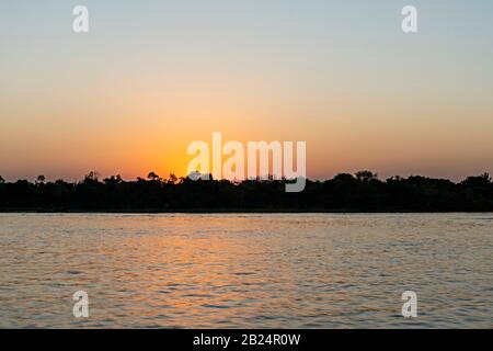 Sunset Over The Water Stock Photo