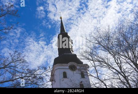 The tower of the St. Mary's Cathedral (Dome Church) in Tallinn on blue sky background with clouds. Stock Photo