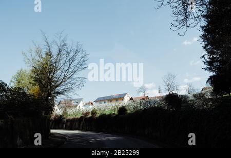 View from the street of multiple large houses on a sunny day with clear blue sky Stock Photo
