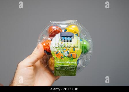 PAris, France - Apr 24, 2019: Man hand holding Dietz Ostereerset set of easter eggs made from diverse type of sausage Stock Photo