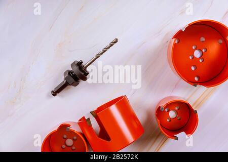 Hole saw or hole cutter tools for wood is a drill of bits hole saw for making large holes in wood Stock Photo