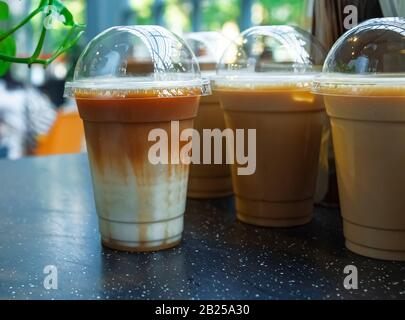 Iced caramel macchiato.  Beautiful layering and colors.  Below is cold milk.  Above is the espresso and caramel sauce just poured.  Memorable coffee. Stock Photo