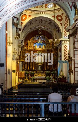 LIMA / PERU - May 10 2016: The interior of the beautifully decorated Saint Francis Catholic Church with elaborate paintings and gold leafing in Lima, Stock Photo