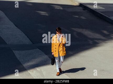 Young lawyer using his cellphone during walking in the city center Stock Photo