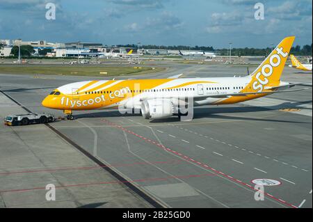 31.01.2020, Singapore, Republic of Singapore, Asia - A Scoot Airlines Boeing B787 Dreamliner passenger plane during pushback at Changi Airport. Stock Photo