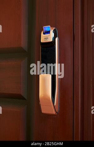 Close-up of a smart door lock with fingerprint area open Stock Photo
