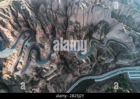 aerial view of a steep mountain road Stock Photo