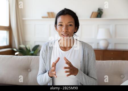 Headshot portrait talk on video call at home Stock Photo