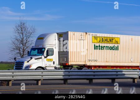 Feb 17, 2020 Stockton / CA / USA - J.B. Hunt truck driving on the interstate; J.B. Hunt Transport Services, Inc.  is an American transportation and lo Stock Photo