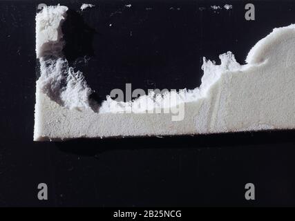 grunge black plastic and white foam board useful as a background Stock Photo