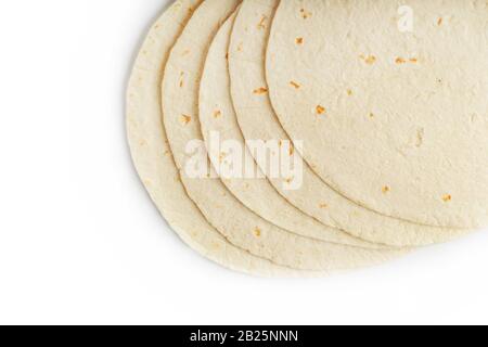 Tortilla on a white isolated background. Corn tortilla or simply tortilla is a type of thin unleavened bread made from Hominy. Bread products Stock Photo