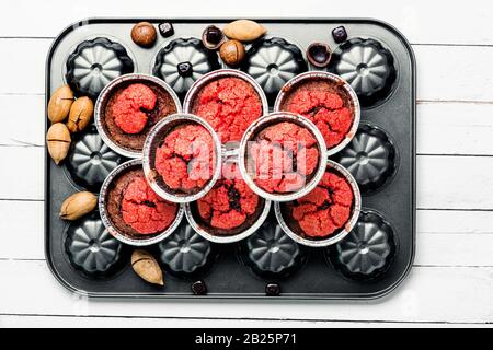 Homemade delicious muffins with nuts and chocolate. Stock Photo