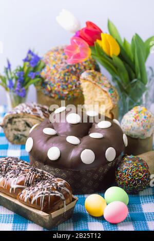 easter cakes and spring flowers, easter bread and eggs Stock Photo