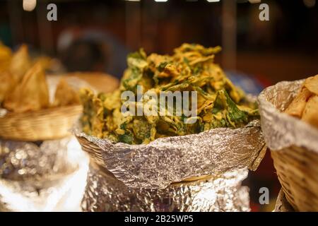 Ingredients samosa closeup, a beautiful Indian dish, national food in a basket. Night Market Goa India Stock Photo