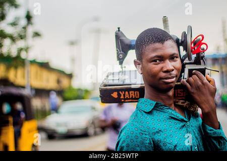 Mobile tailor on a street in Lagos, Nigeria Stock Photo - Alamy