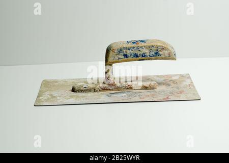 Smoothing trowel for applying and spreading mortar on walls, ceilings and floors Stock Photo