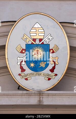 Coat of arms of Pope Francesco on the facade of the San Tommaso da Villanova Church, Castel Gandolfo, Lazio, Italy Stock Photo