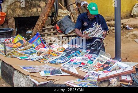 Newspaper vendor on a street in Lagos, Nigeria. Stock Photo