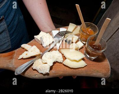 Assortment of cheeses with jam on a cutting board, Castel Gandolfo, Lazio, Italy Stock Photo