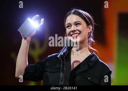 Berlin, Germany. 29th Feb, 2020. Actress Paula Beer of film 'Undine' celebrates after receiving the Silver Bear for Best Actress during the awards ceremony of 70th Berlin International Film Festival in Berlin, capital of Germany, Feb. 29, 2020. Credit: Shan Yuqi/Xinhua/Alamy Live News Stock Photo