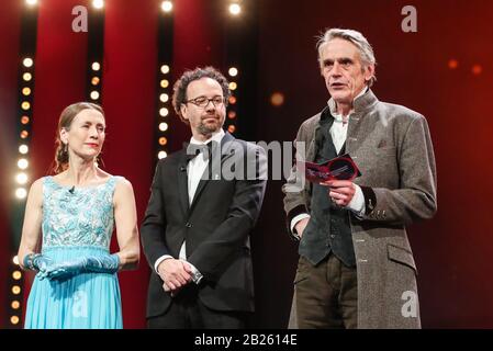Berlin, Germany. 29th Feb, 2020. President of the International Jury Jeremy Irons (R) announces the winner of the Golden Bear for Best Film with Berlinale Executive Director Mariette Rissenbeek (L) and Berlinale Artistic Director Carlo Chatrian standing aside during the awards ceremony of 70th Berlin International Film Festival in Berlin, capital of Germany, Feb. 29, 2020. Credit: Shan Yuqi/Xinhua/Alamy Live News Stock Photo