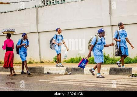 Students in school uniform walking on the street in Lagos, Nigeria. Stock Photo