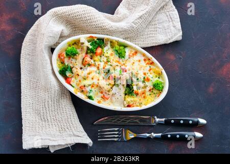 Top view of mac n cheese with zander and vegetables Stock Photo