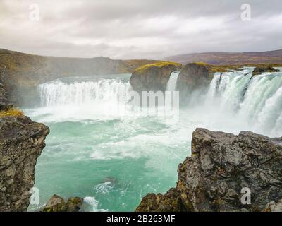 Godafoss waterfall in Iceland plunge pool full of turquoise water in autumn Stock Photo