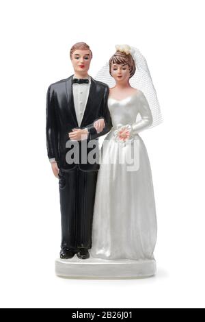 Bride and groom, vintage cake topper isolated on white background Stock Photo