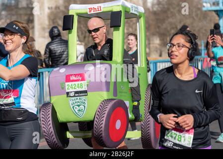 Tower Bridge, London, UK. 1st Mar, 2020. The Vitality Big Half is a 13.1 mile half marathon taking in a number of the London Marathon locations, including crossing Tower Bridge. Phil Sweatman running in tractor costume for Team Ben Hammond Stock Photo