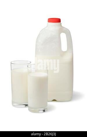 Plastic can and glass with fresh organic buttermilk  isoloated on white background Stock Photo