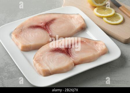 Two raw fresh swordfish fillets on a dish Stock Photo