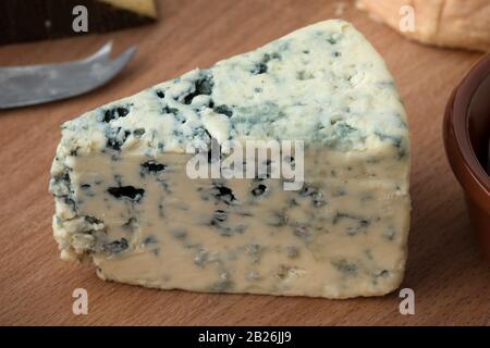 Wedge of Danish creamy blue cheese for a snack close up Stock Photo