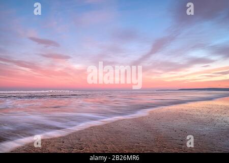 Westward Ho! Devon beach, coastline, incoming tide, sand, sea, dramatic, stunning, shoreline, romantic evening, evening light, United Kingdom, South Stock Photo