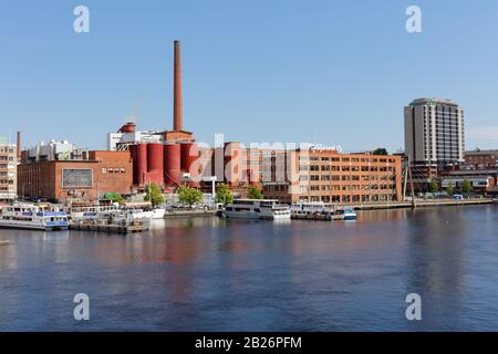 Tampere, Finland - June 11, 2018: Cityscape of Tampere with Metsa Board Taco factory at the bank of Tammerkoski. Established in 1865 Stock Photo