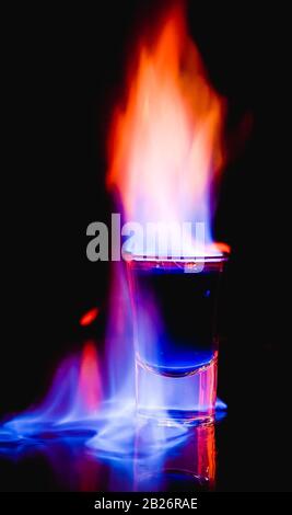 burning drink in shot glass Stock Photo